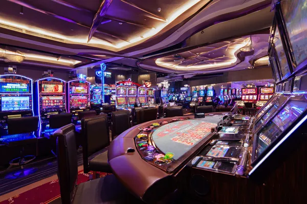 7555BEF Live Games — Take part in high-energy casino action A glowing roulette wheel with cascading chips, symbolizing the engaging live and instant-win games available on 7555BEF.