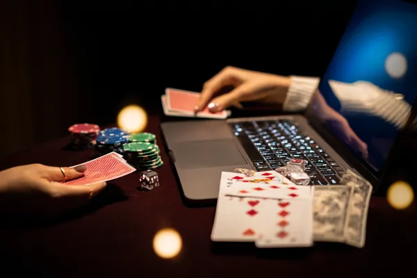 A player using their smartphone during a festive local event, representing 7555BEF’s fully mobile-friendly casino.